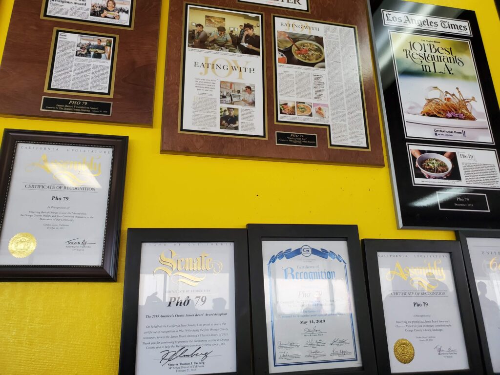 A wall in Pho 79 displaying all the awards Pho 79 has won through the years