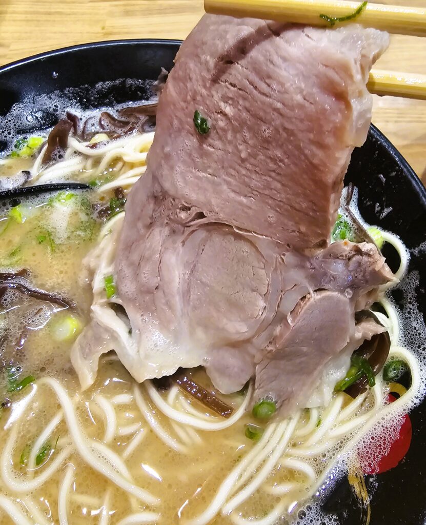 The piece of chashu in the bowl of tonkatsu