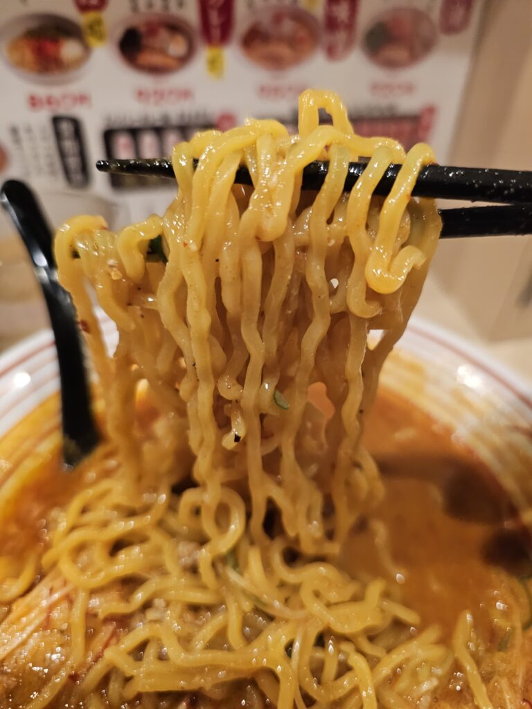 The thicker and curlier noodles in the spicy miso ramen